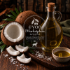 Coconut Infused White Balsamic from EVOO Marketplace with fresh coconut and barrel-aged white balsamic vinegar